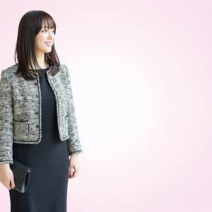 ピンク背景のスタイリッシュな女性ポートレート