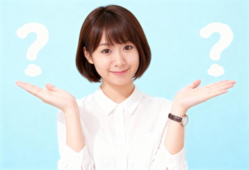 白い襟付きのシャツを着た、ショートボブのヘアカットをしたアジア系の若い女性が、頭の上...。